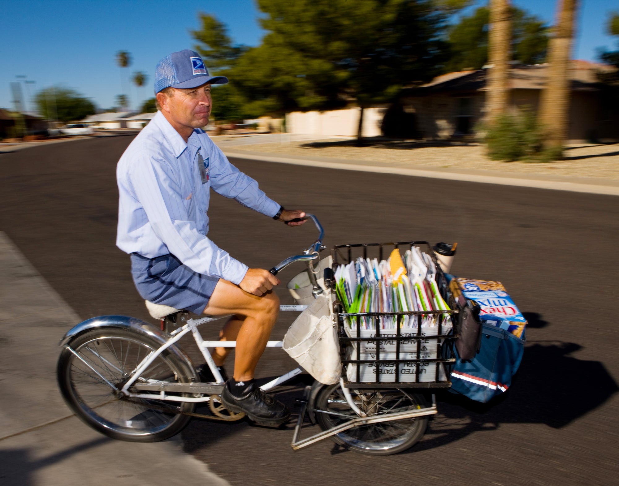 USPS Mail Delivery Person on a Bicycle in Sunny California Photo Credit United States Postal Service