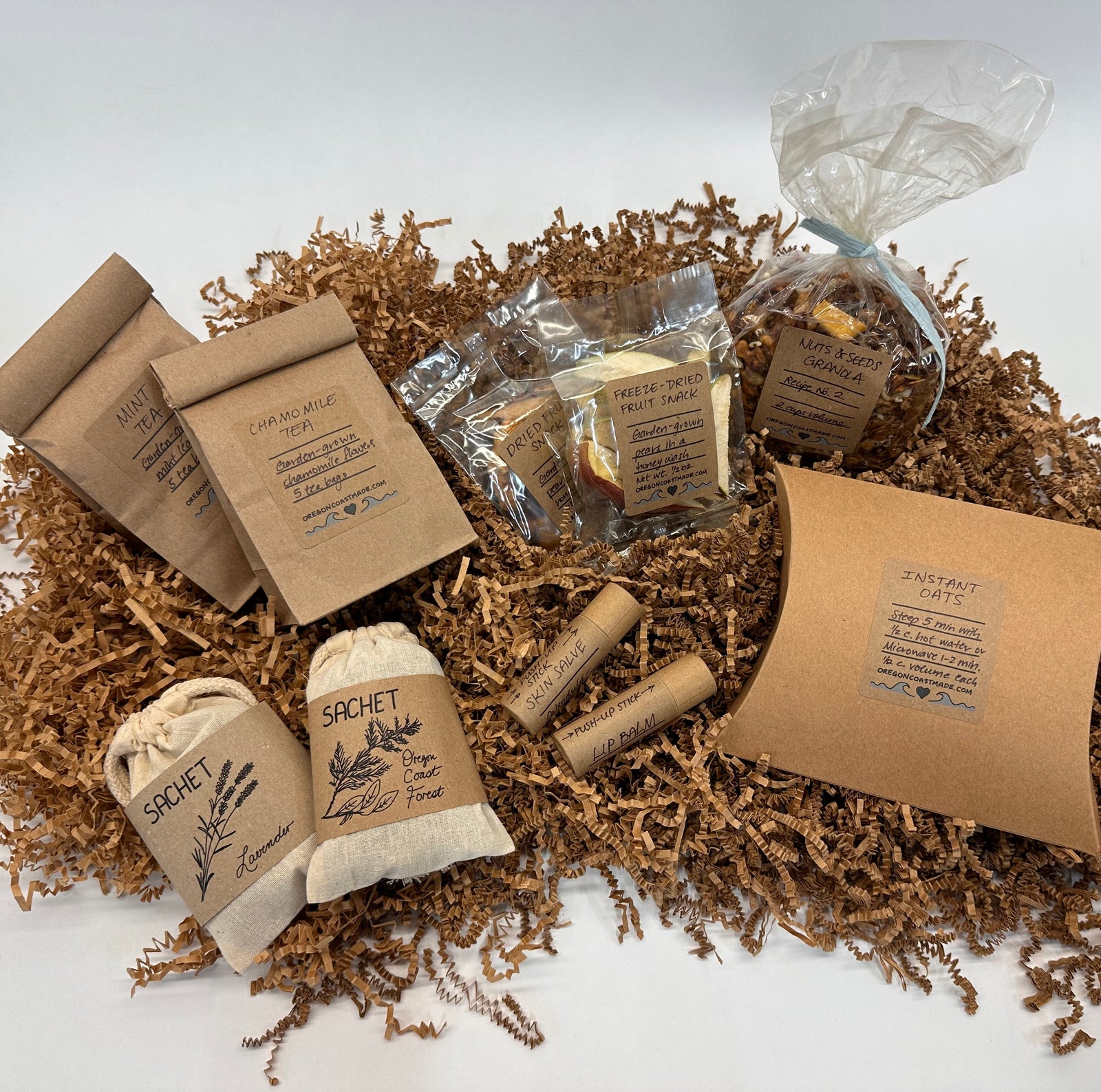 Collection of natural products including bags, sachets, and packets on a textured surface.