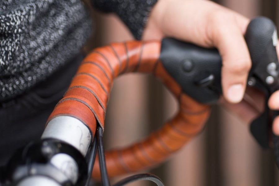 Close-up of handlebars with honey leather coiled and wrapped around