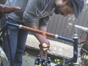 Man demonstrates how to install the bike cinch.