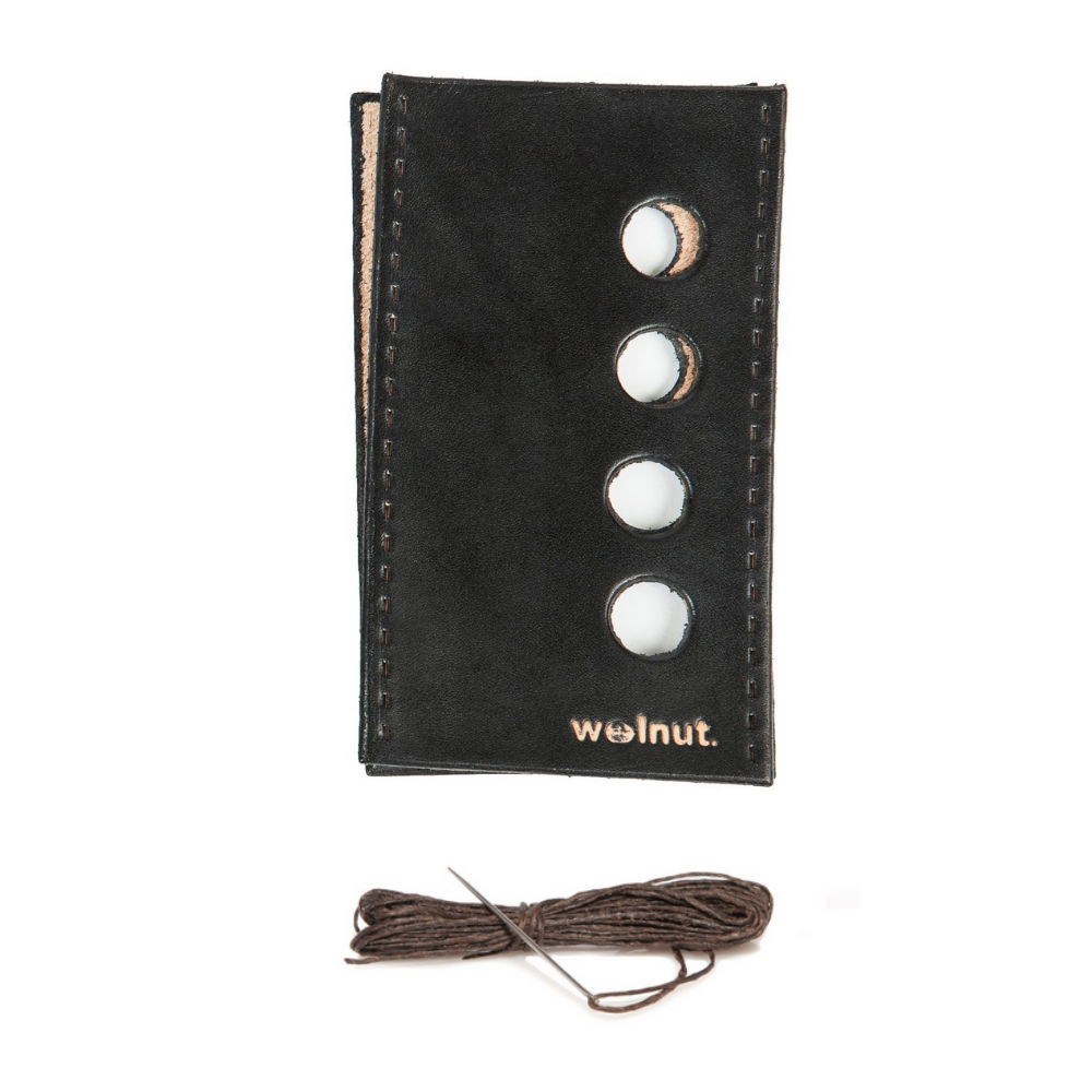 White background variant photo showing the product as it comes in the package: Black leather with dark brown thread