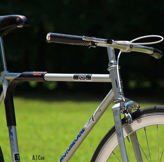 Customer photo showing black leather sew-on bicycle grip on a silver Motobecane bicycle