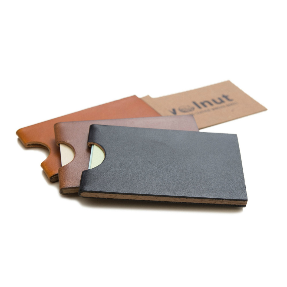 Three color variants of the business wallet shown: honey, dark brown, and black