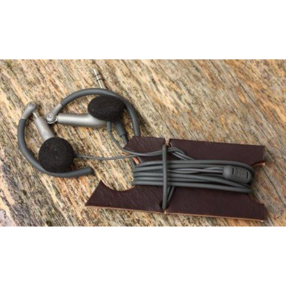 Dark brown earbud organizer with black headphones
