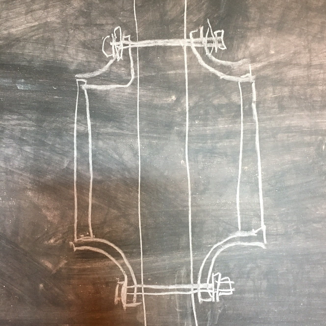 A hand-drawn sketch on a chalkboard should the Sellwood wood/leather handle being installed on both sides of a door