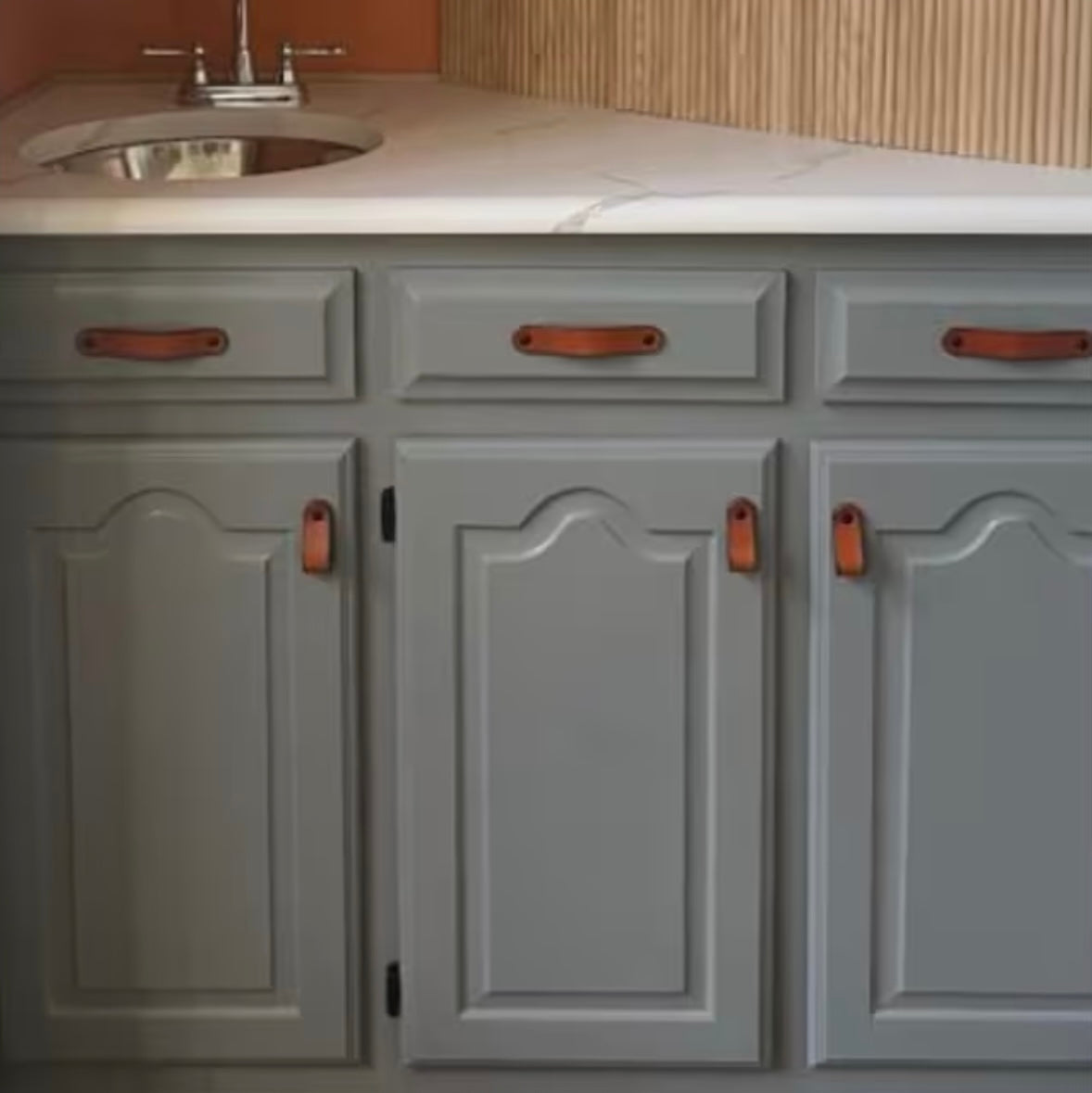 This customer review photo features the Hawthorne Small leather handle installed two different way (without the washers): flat as a handle on the upper drawers, and folded as a loop on the lower cabinet doors. 