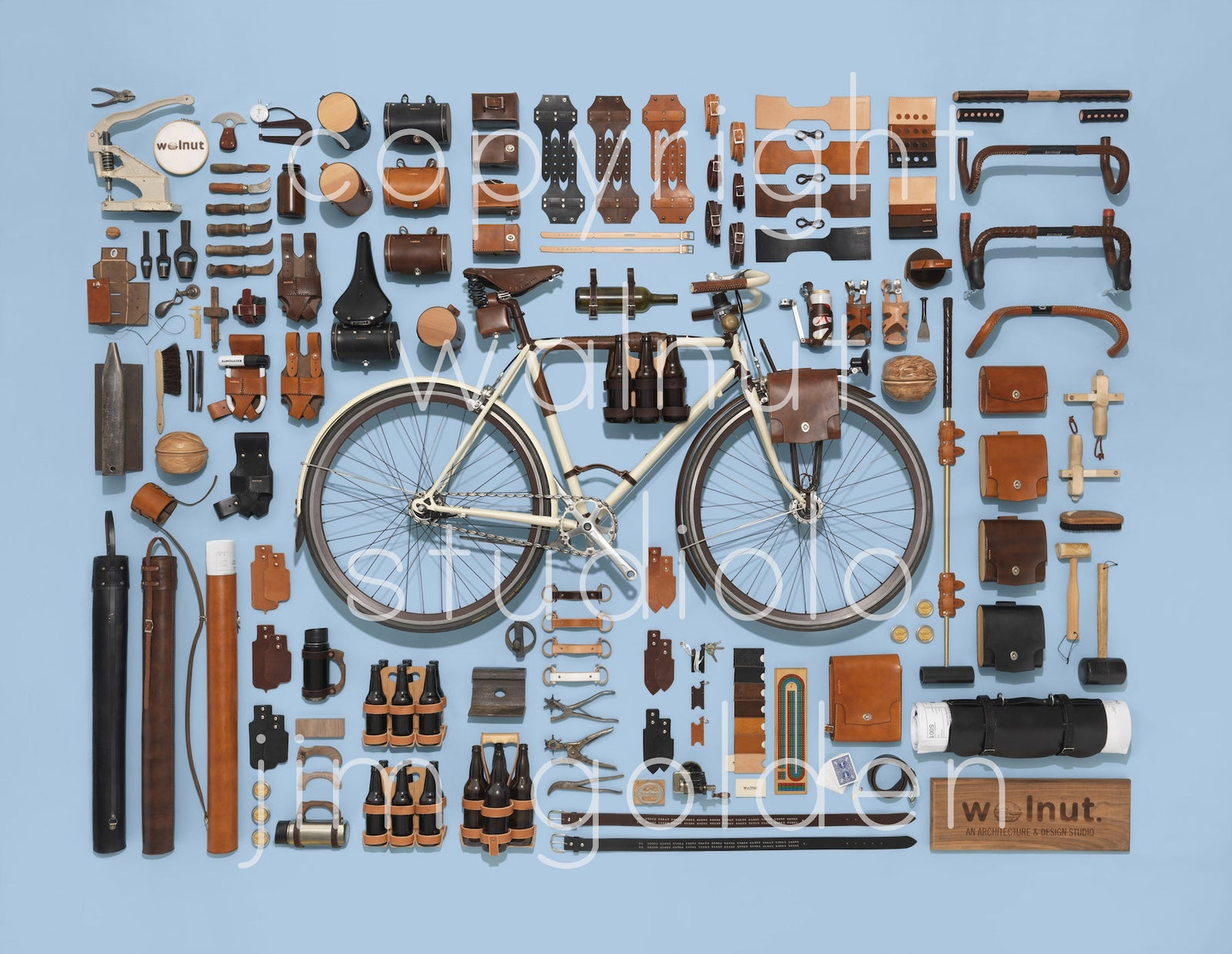 Jim Golden art print of an assembly of leather bicycle accessories surrounding a bicycle on a blue background