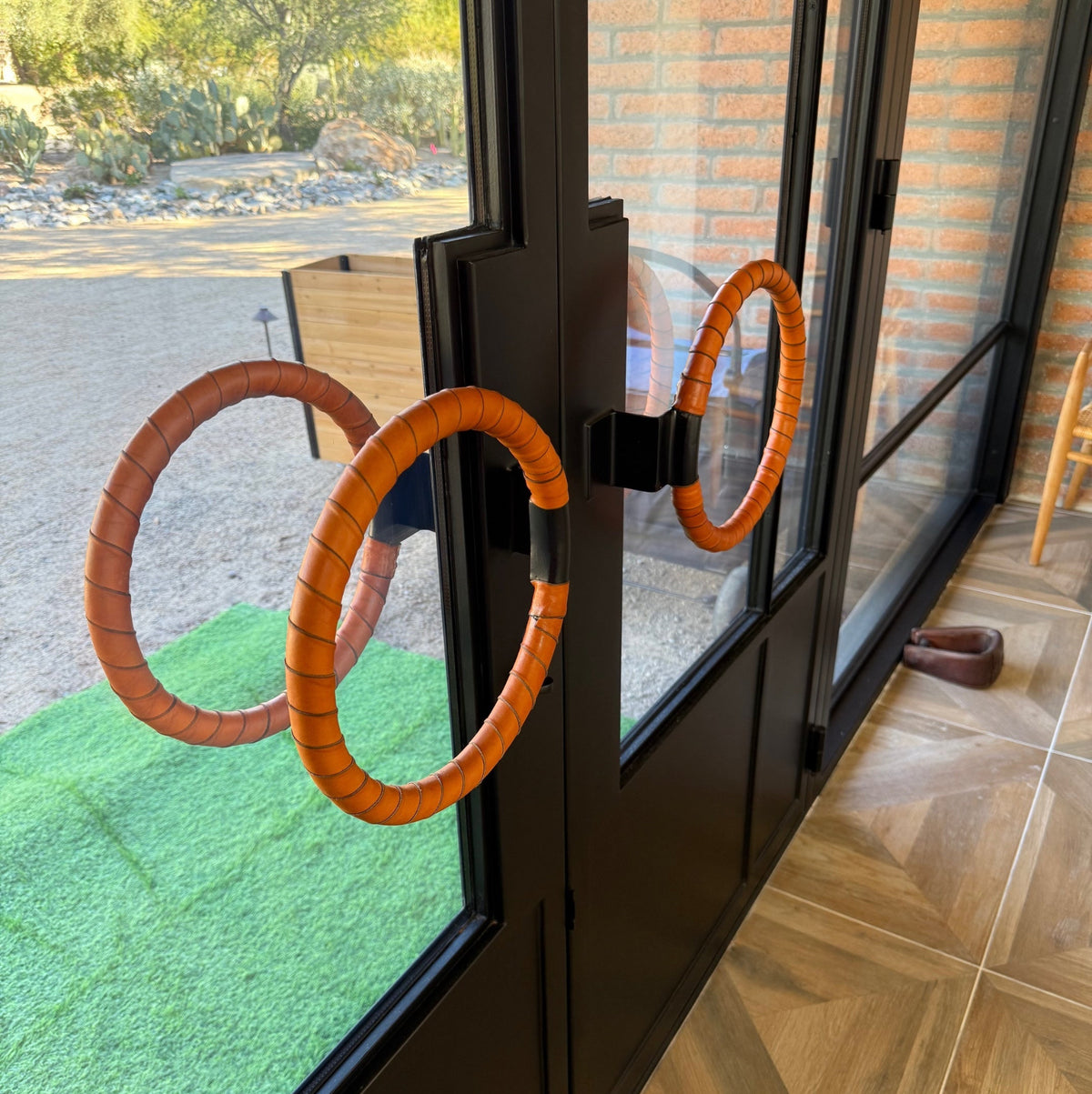 Customer photo of Commercial exterior door with two circular door handles wrapped in honey leather