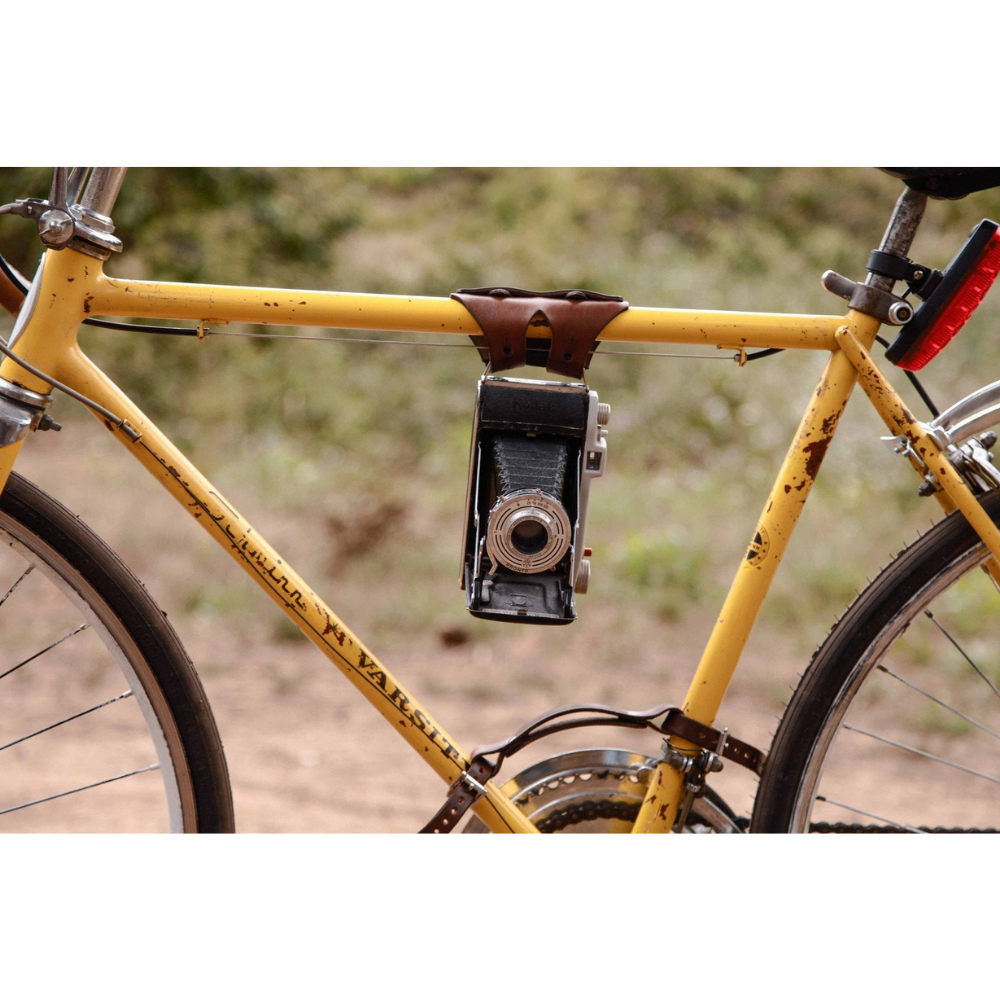 Dark brown 6-pack frame bike cinch used to creatively hold a camera. 