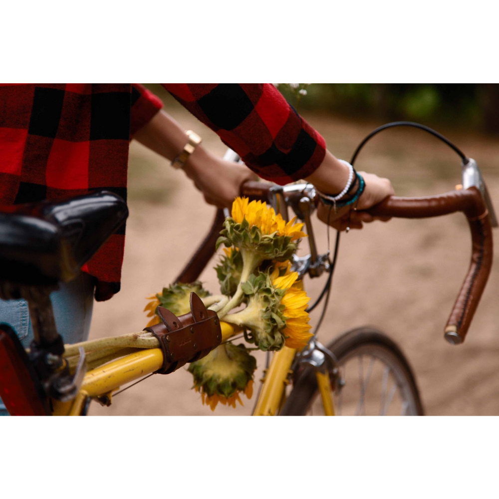 6-pack frame cinch used to hold flowers against the top tube of a bicycle frame.