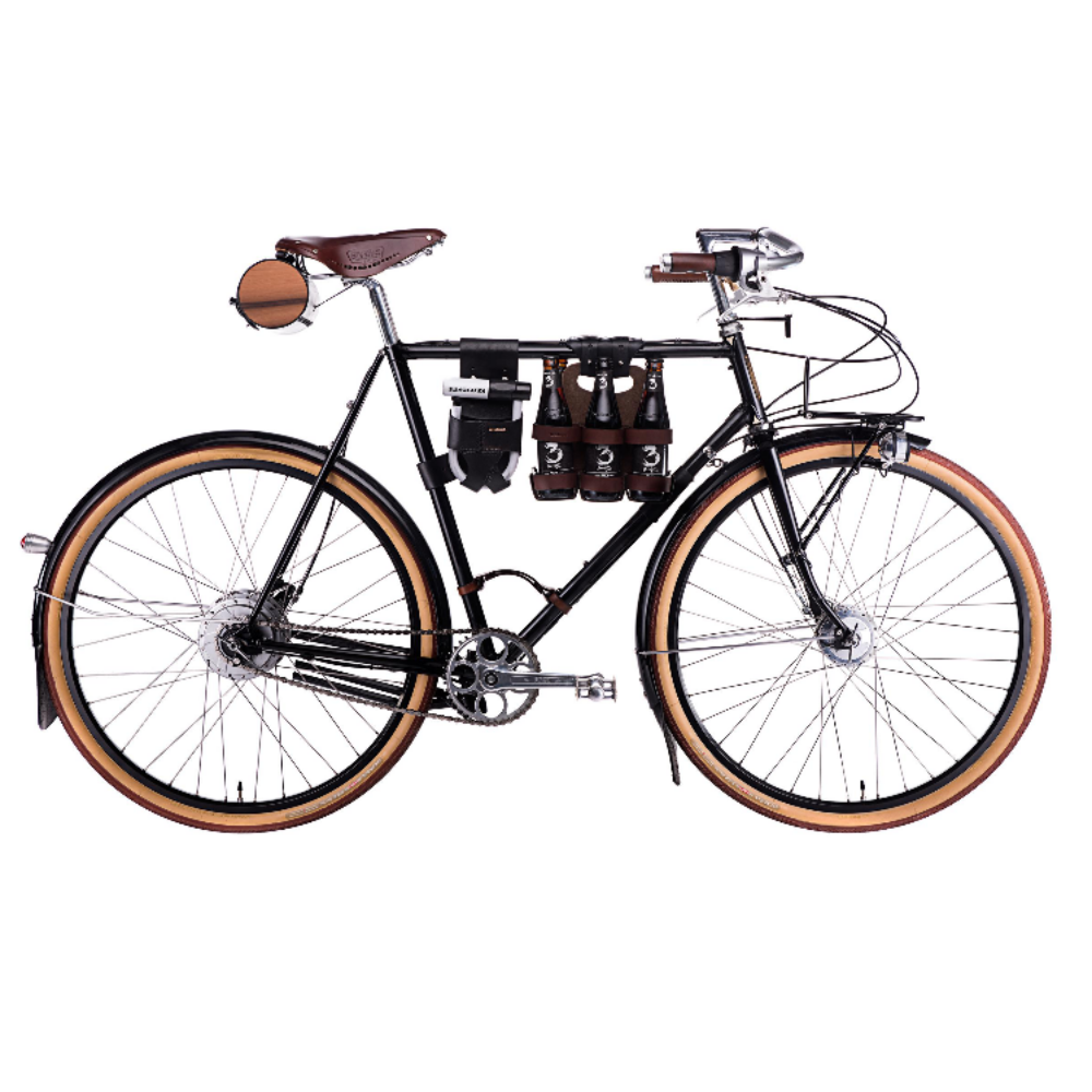 Black bicycle on a white background with several walnut studiolo accessories. Among the featured bicycle accessories are a &amp;quot;little lifter&amp;quot; bike handle, the &amp;quot;spartan carton&amp;quot; beer holder, and the &amp;quot;barrel bag&amp;quot; saddle bag.