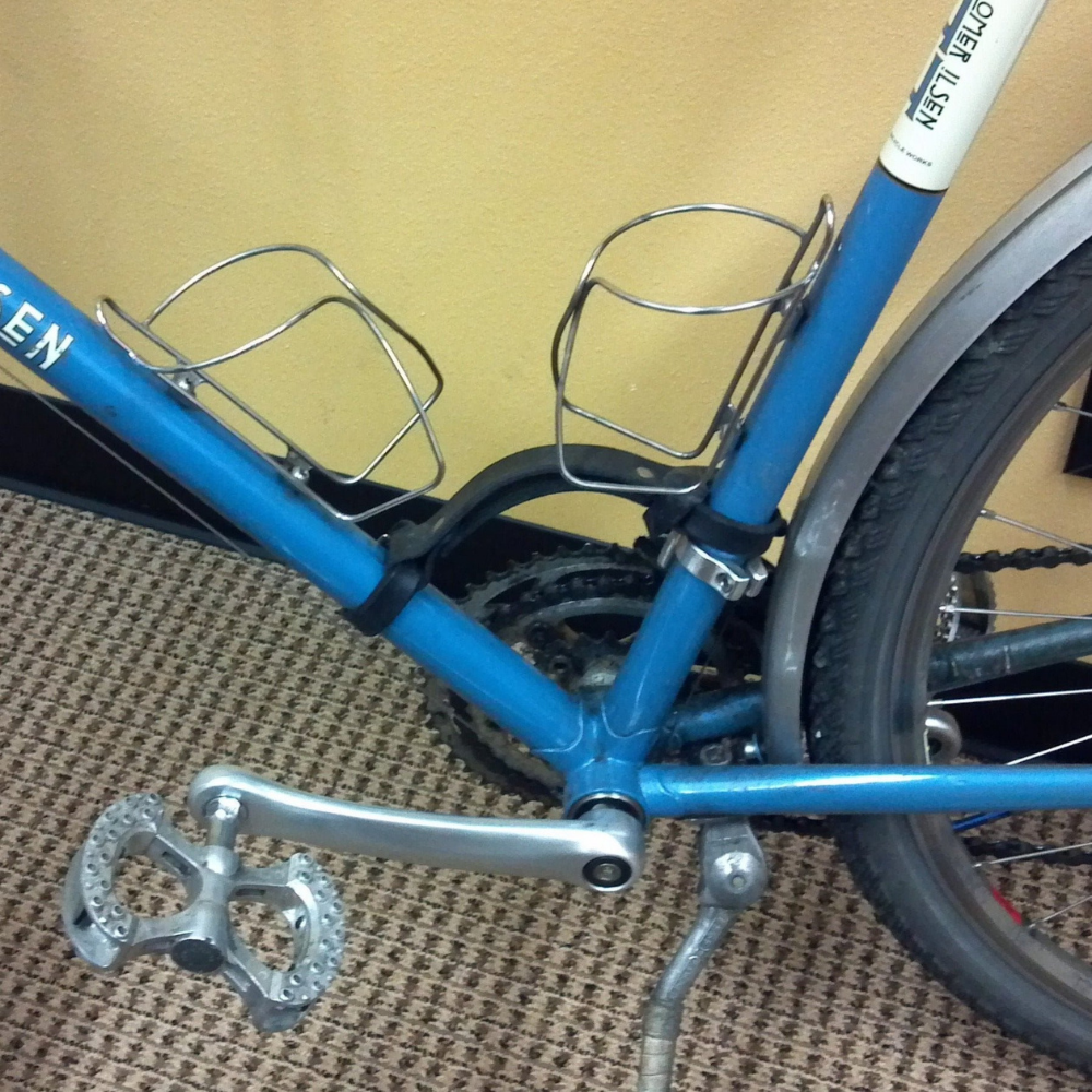 Black leather &quot;little lifter&quot; bike handle shown on blue bike frame