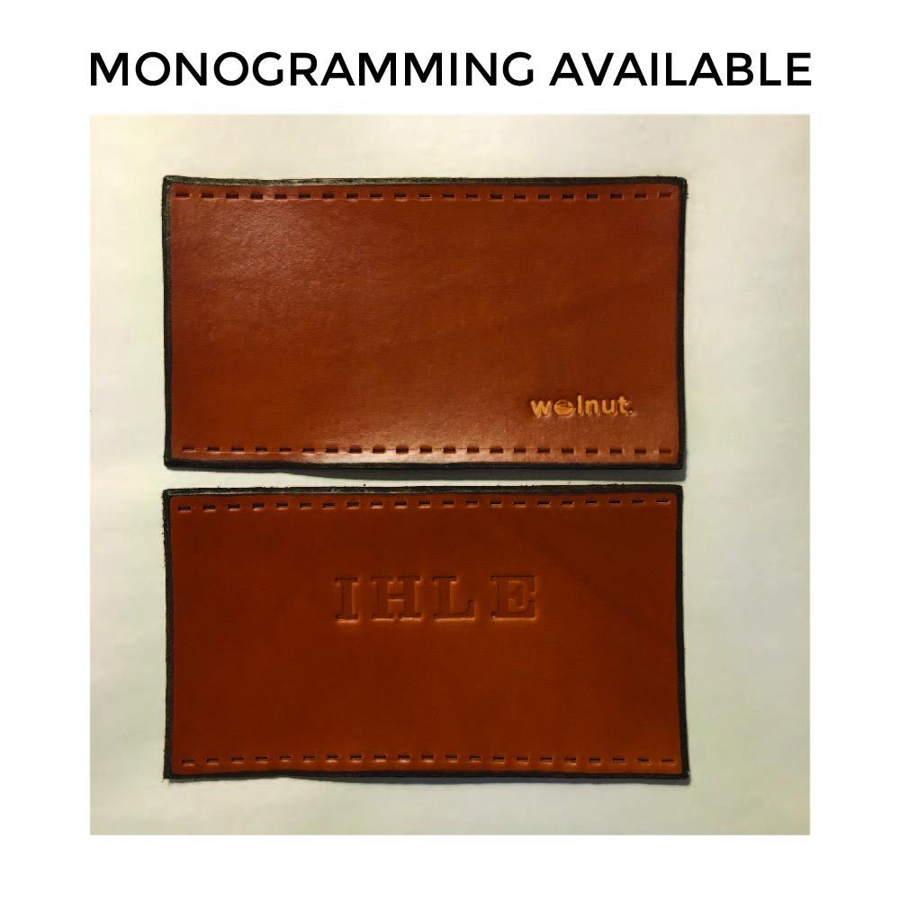 Title: &quot;monogramming available&quot;. Shows two leather grips in honey with one customer&#39;s initials on one grip, debossed with alphabet stamps for personalization. 
