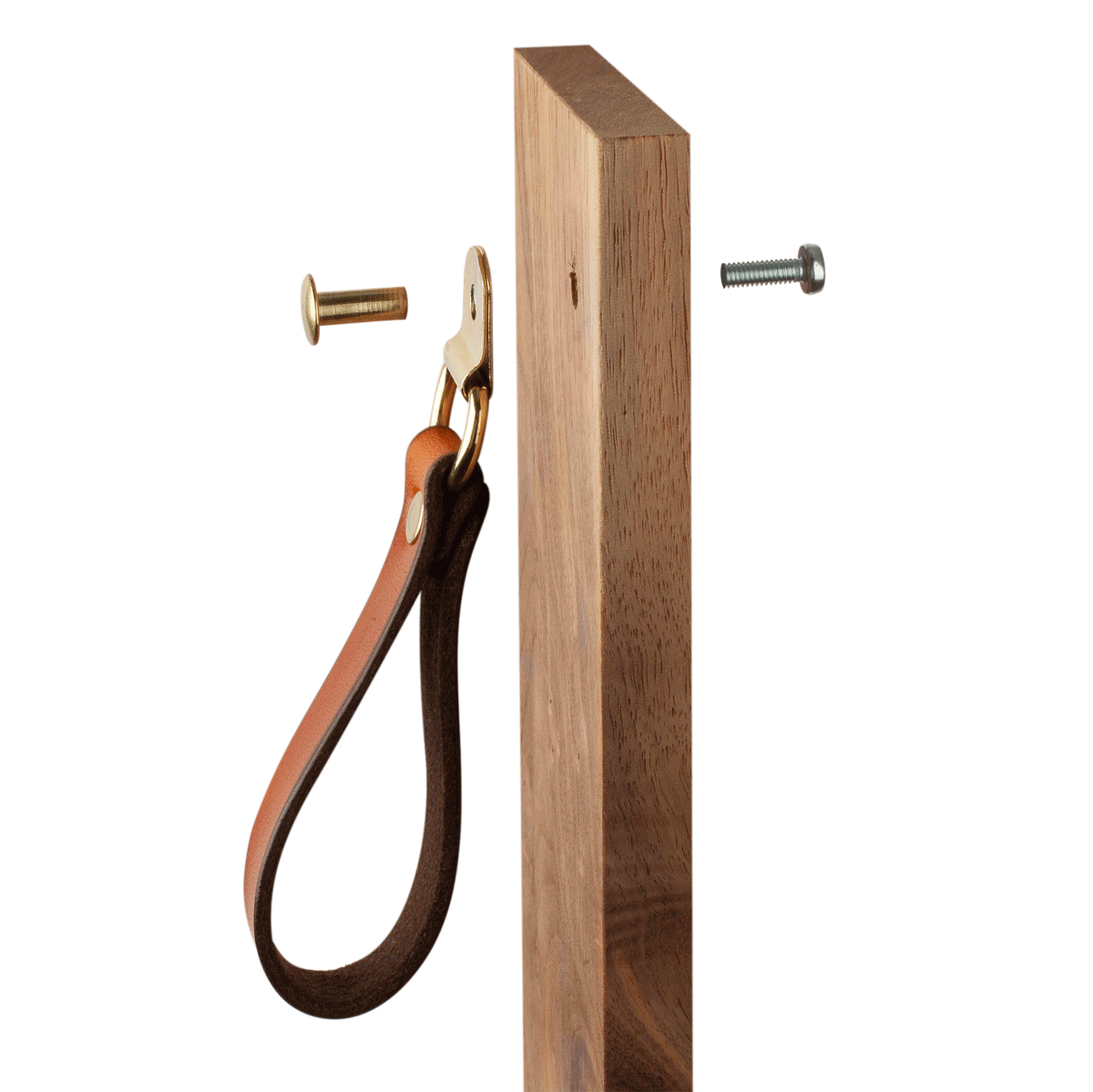 Animated GIF image of installing the hardware of the Burnside hinged leather handle with hardware, on a template wood cabinet door. The hardware uses a surfaceless head Chicago screw on the front side of the cabinet and a threaded back screw to secure it to the door. 