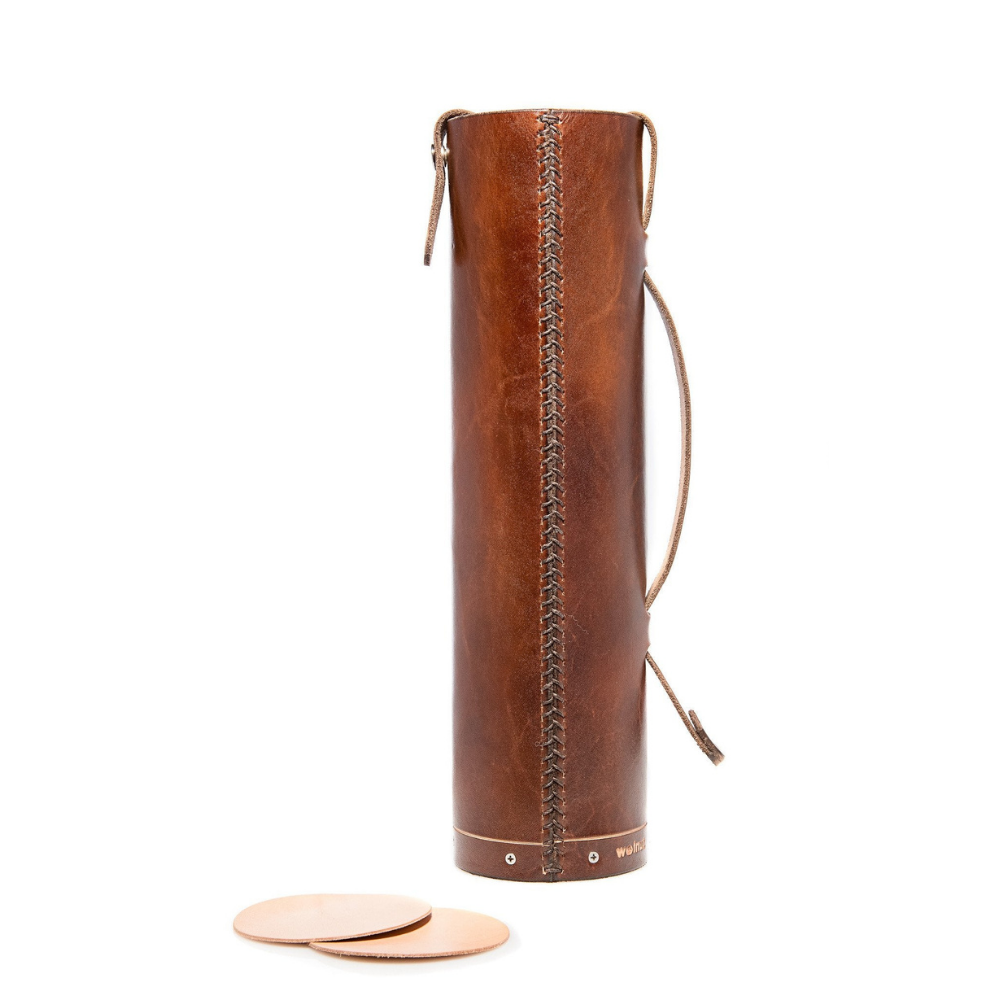 White background variant photo showing what is included in an order: a dark brown leather bottle case and two natural leather coasters that fit inside the tube and can be used as spacers or cushions for bottles.