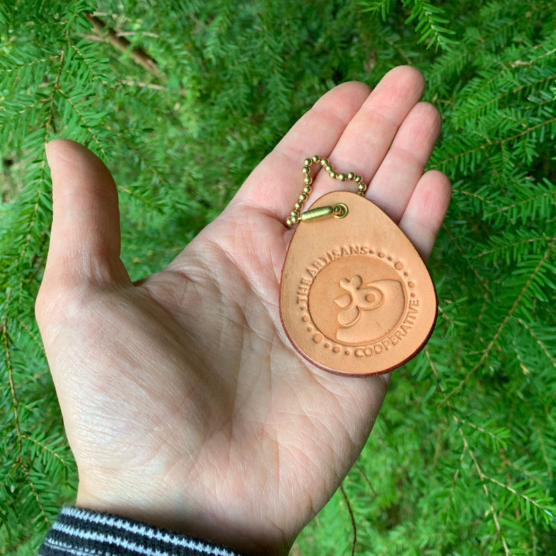 Leather keychain in the palm of a woman's hand