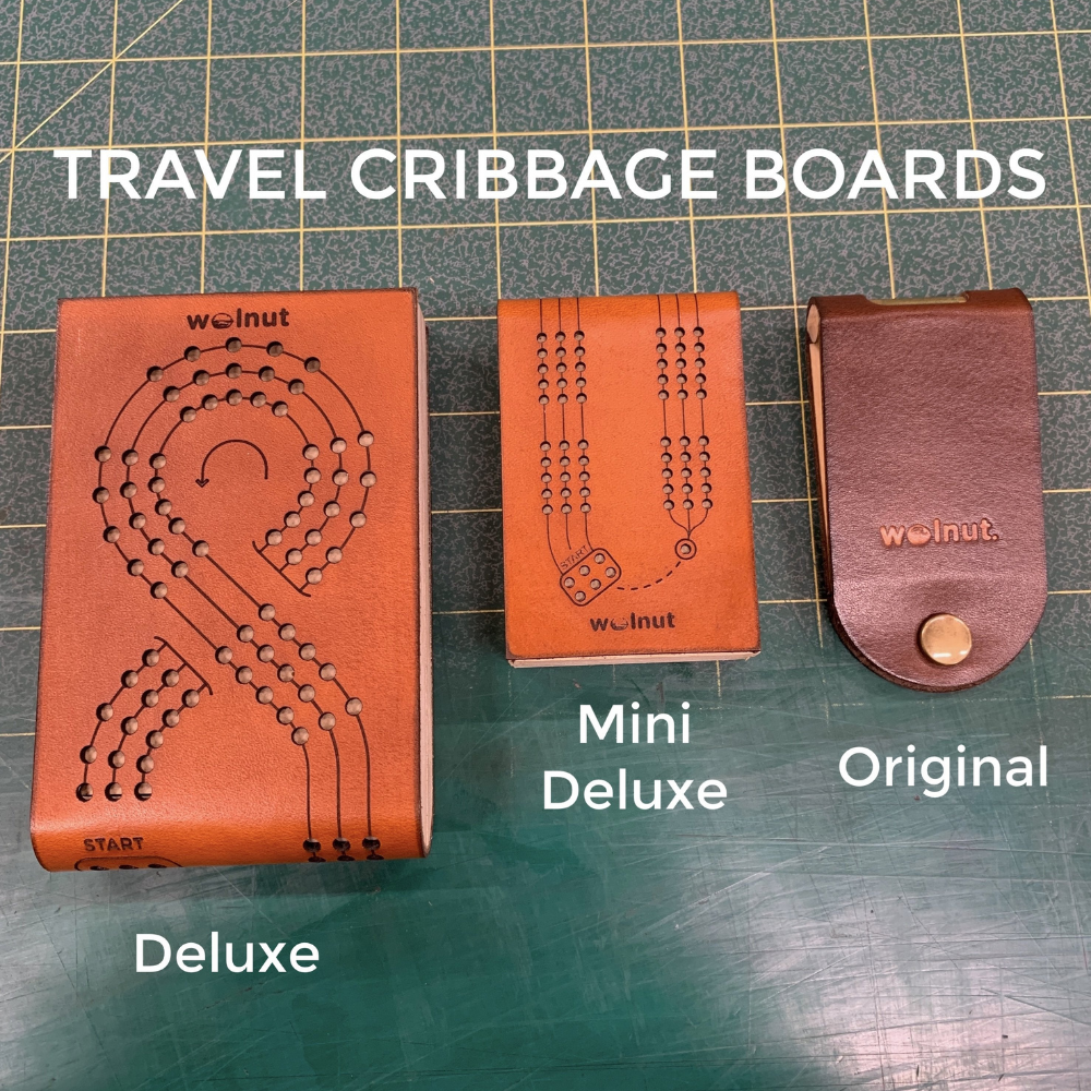 Shows all 3 designs of. Walnut Studiolo&#39;s folding leather and wood cribbage boards on a 1-inch grid mat for a size comparison: the Deluxe, Mini Deluxe, and Original Travel Cribbage Boards.