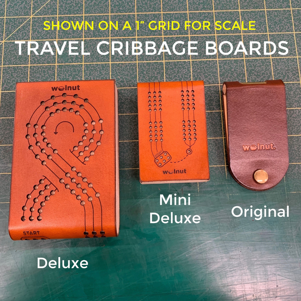 Shows all 3 designs of. Walnut Studiolo&#39;s folding leather and wood cribbage boards on a 1-inch grid mat for a size comparison: the Deluxe, Mini Deluxe, and Original Travel Cribbage Boards. 